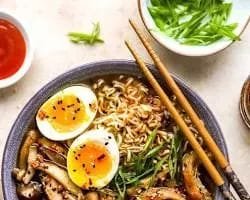 Step-by-step cooking process of boiling chicken bones to create a creamy broth for this Chicken Ramen Recipe.
